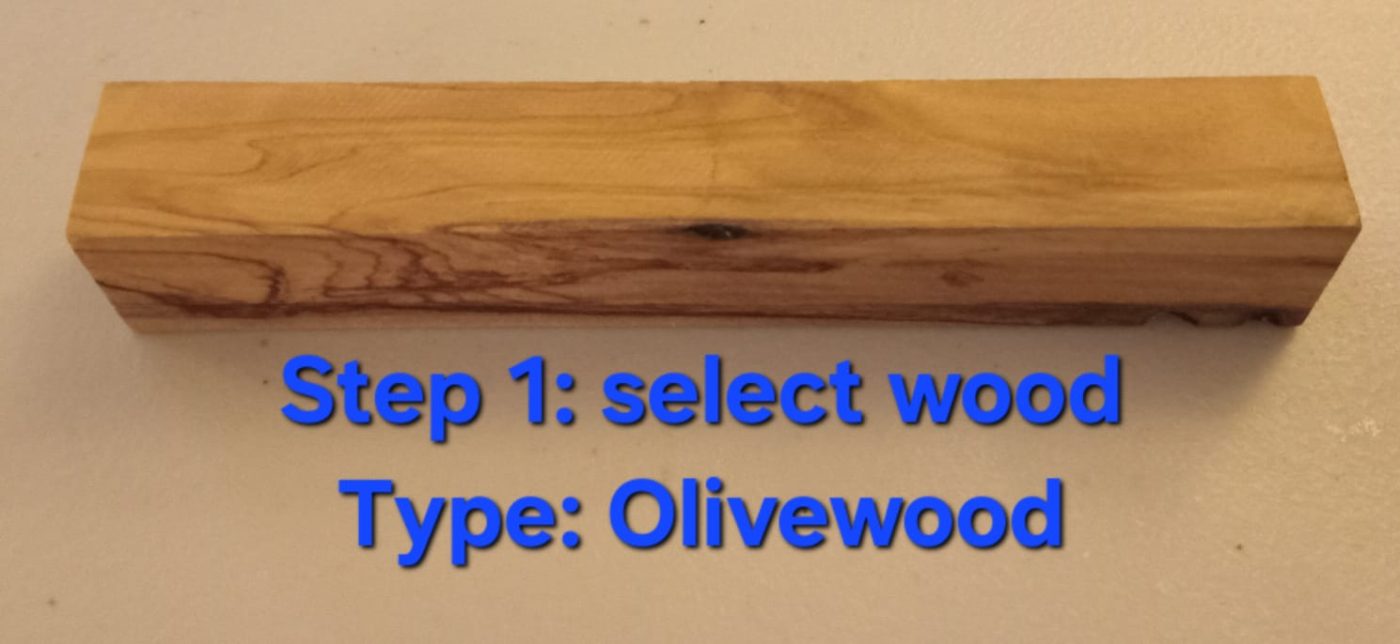 Select the blank — a rectangular olivewood pen blank showing rich grain