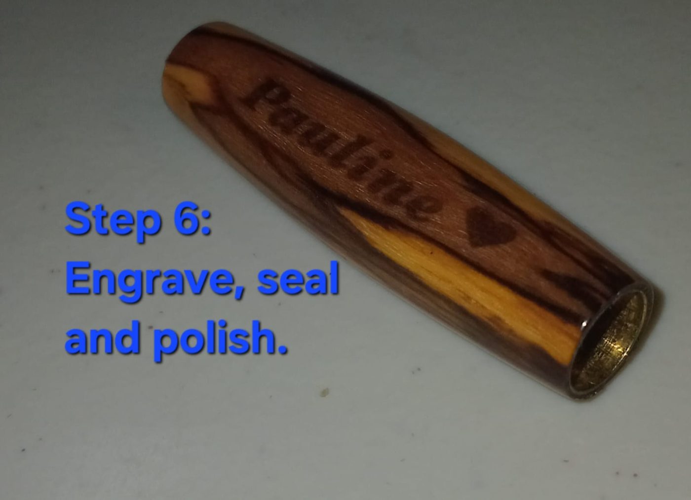 Engrave, seal & polish — name 'Pauline' engraved into the polished olivewood barrel
