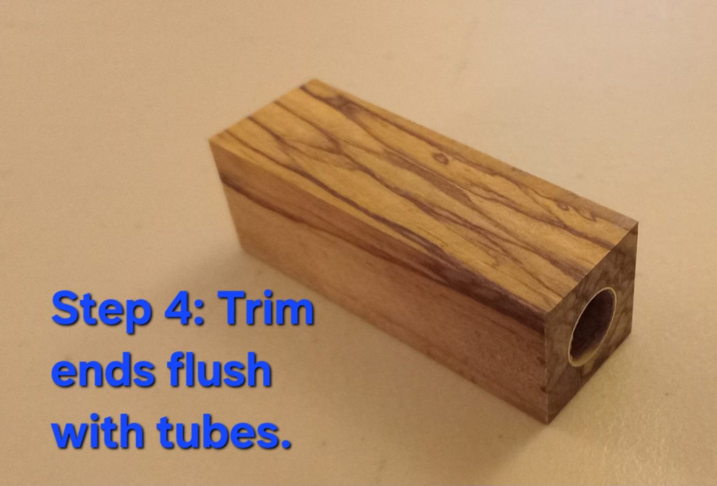 Trim flush — wood blank trimmed flush with the brass tube ends