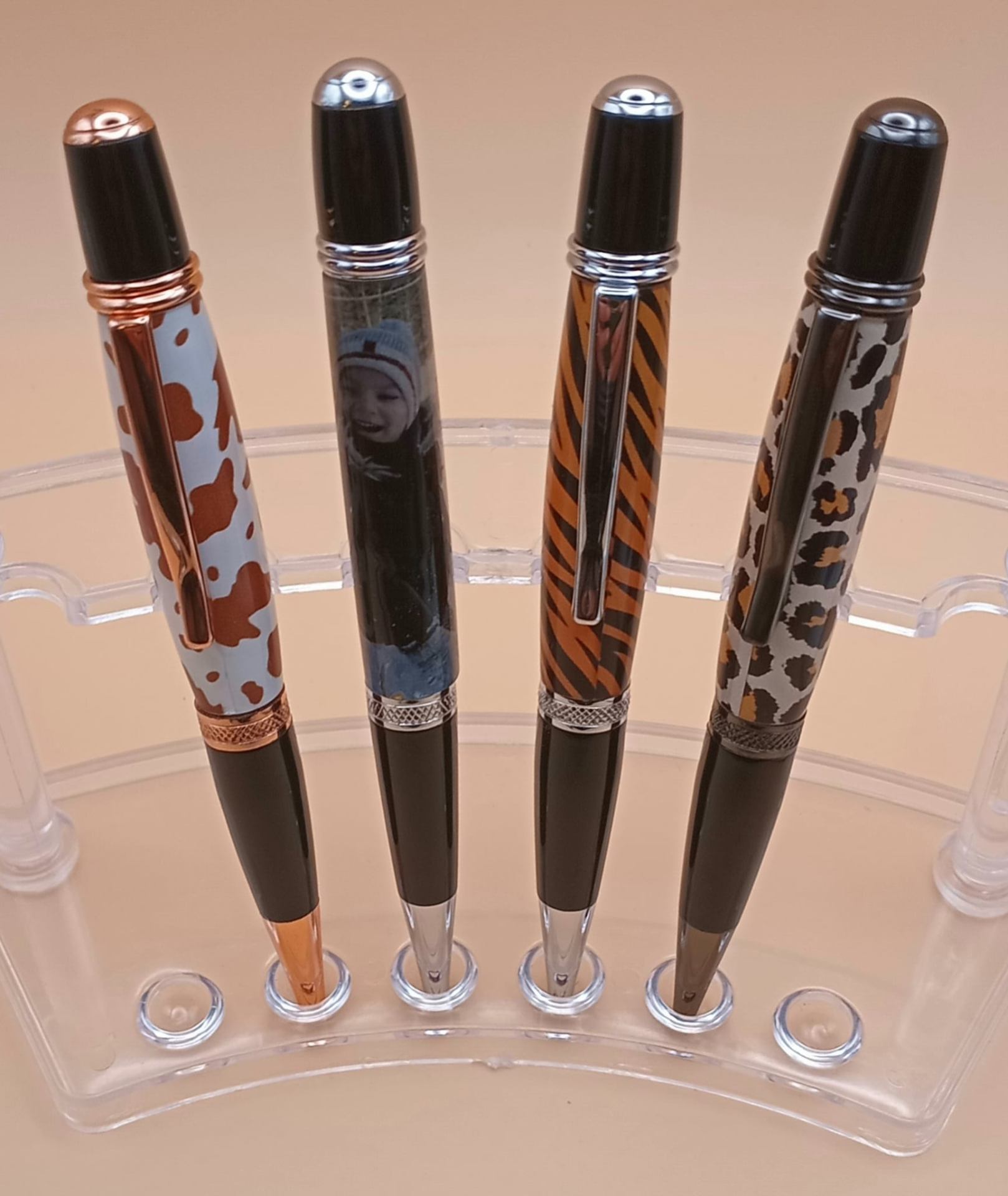 Handcrafted themed pens with cow print, custom photo, tiger stripe, and leopard print designs