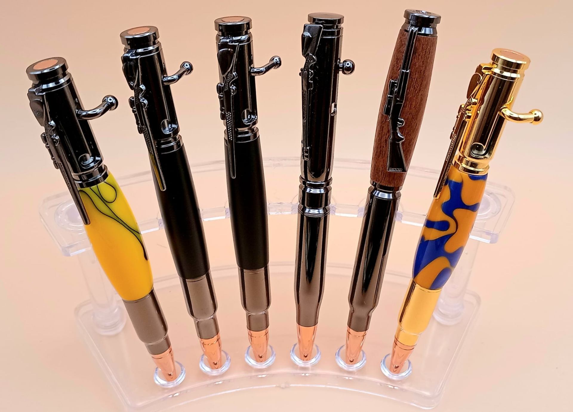 Bolt-action and bullet-styled artisan pens with gunmetal, copper, walnut and gold hardware