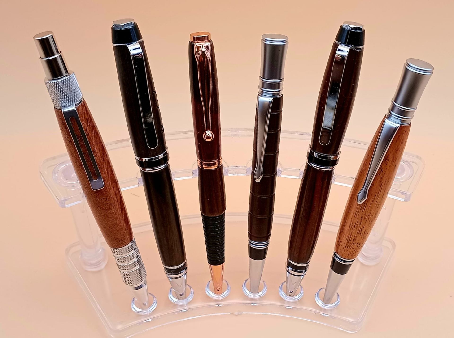 Collection of six handcrafted exotic hardwood pens with chrome, gunmetal and rose-gold fittings